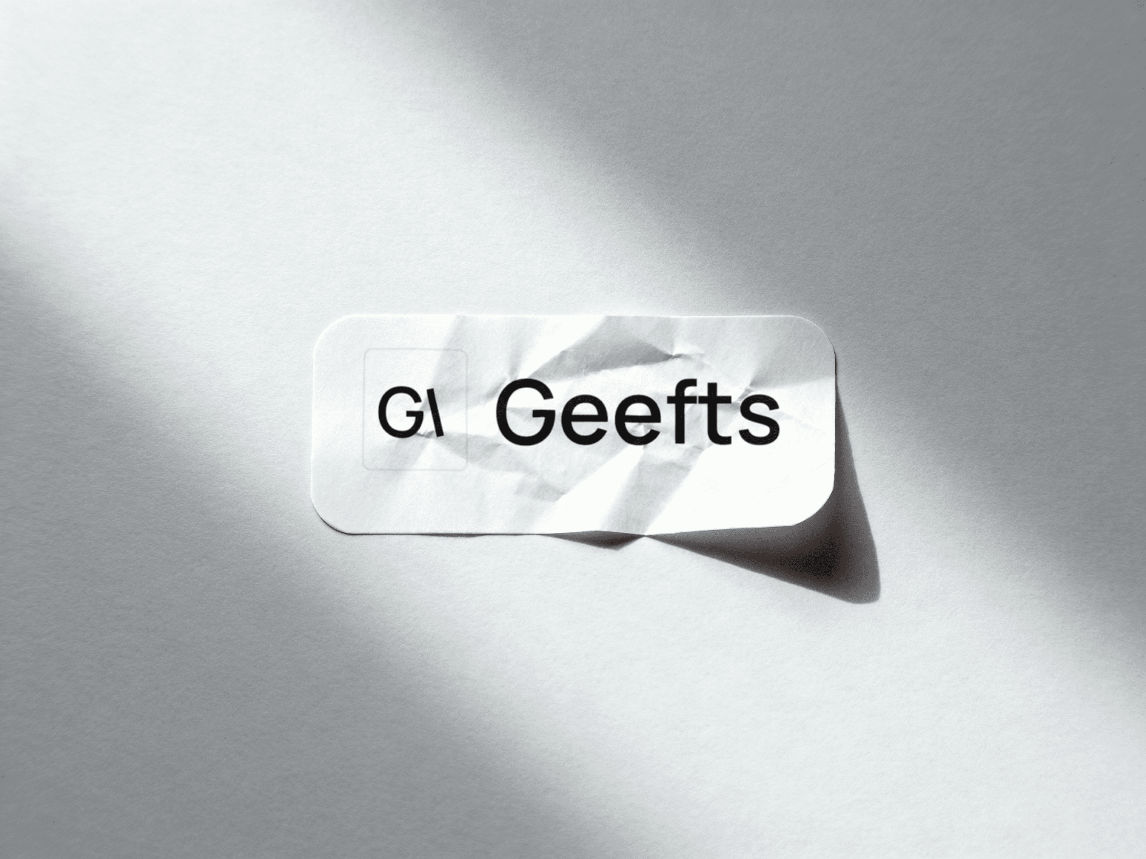 Geefts brand sticker mockup on crumpled paper